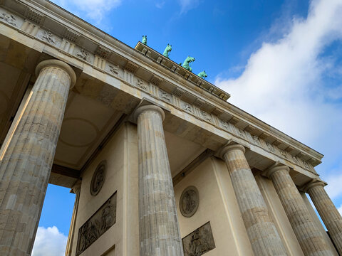 Low angle view of Brandenburg Gate against blue sky in Berlin, Germany. Brandenburger Tor. Parizer Platz.