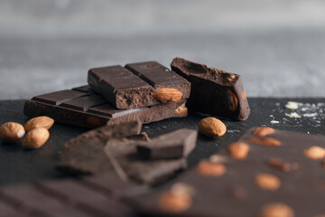 Closeup of dark chocolate chunks on table.