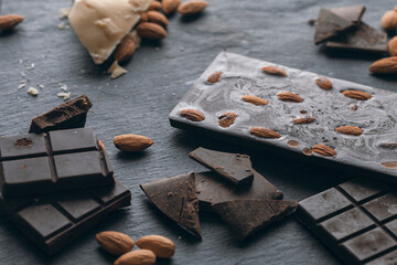 Raw chocolate bars with nuts. chocolate background