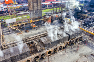 Flight over the metallurgical plant. Smoke and smog in the industrial zone. Environmental pollution concept