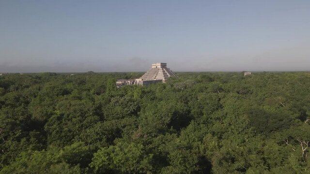 Aerial View of Chichen Itza Kukulkan Temple, Yucatan, Mexico. Ancient Mayan City in Green Rainforest, Drone Shot