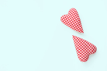 Valentines day composition. Two soft red hearts on pastel blue background. Flat lay, top view, copy space