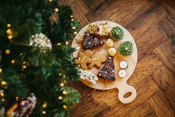 Christmas Pastry and Cookies on A Platter Next To A Christmas Tree