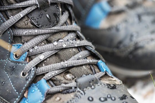 Waterproof Hiking Boots. Closeup Of Footwear With Rain Water Drops