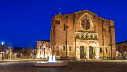 The Basilica of Saint Sernin illuminated at night, in Toulouse in Occitanie, France