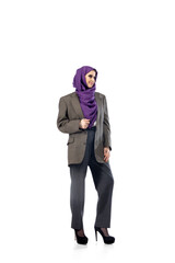 Success. Modern arab woman in stylish office attire isolated on studio background with copyspace for ad. Fashion, beauty, style concept. Female model with trendy make up, manicure and accessories.