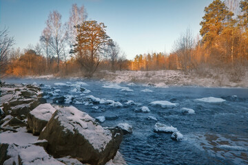 Winter landscape the river in the forest at sunset. Winter sunset rural river landscape.