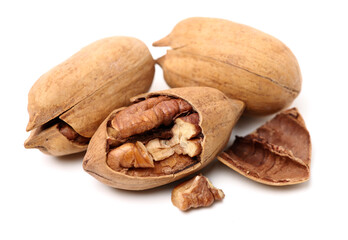 Peeled pecan nuts closeup, isolated on white background