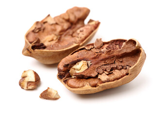 Peeled pecan nuts closeup, isolated on white background