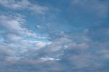 Blue summer sky with white cumulus clouds. Blue sky with clouds nature background.
