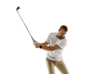 Half length. Golf player in a white shirt taking a swing isolated on white studio background with...