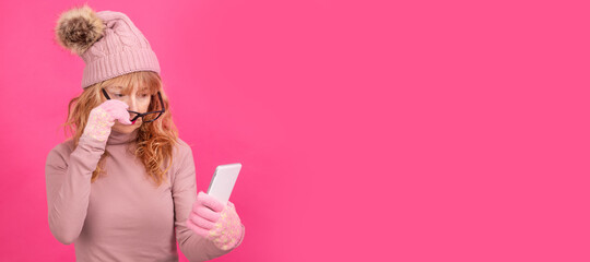 adult woman with mobile phone and warm clothes