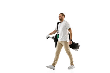 Fototapeta na wymiar Going on. Golf player in a white shirt practicing, playing isolated on white studio background with copyspace. Professional player practicing with bright emotions and facial expression. Sport concept.