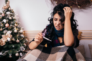 Woman lying bed scarf heat hyperthermia home. Lady sick ill cold fever covered blanket freezing,...