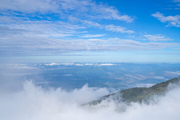 Beautiful scenic view of mountains and clouds against the sky in Kew Mae Pan nature trail at Doi Inthanon, Chiang Mai, Thailand. Famous tourist attractions of Thailand. Concept of holiday and travel