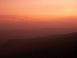 Dramatic sunset gradient shade mountain landscape of Phu Kradueng National park. Thailand. Warm tone image