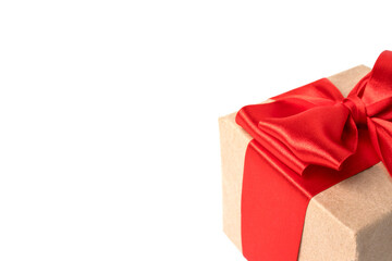 Christmas card with gift box red ribbon on white background. Copyspace.