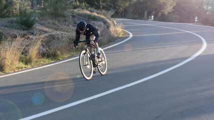 Fototapeta premium cyclist with race bike on the road
