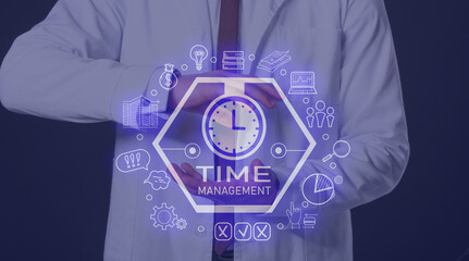 Fototapeta na wymiar Male doctor using virtual clock on dark background.Time management concept