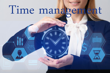 Young businesswoman using virtual clock on grey background. Time management concept
