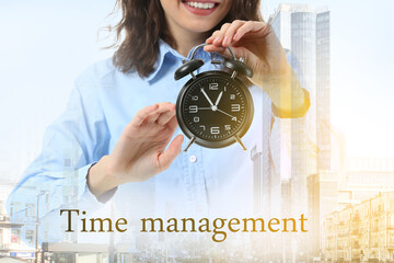 Double exposure of  businesswoman with alarm clock and modern city. Time management concept