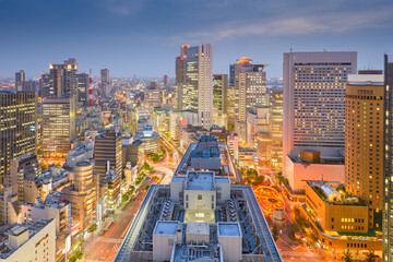 Naklejka na ściany i meble Osaka, Japan downtown city skyline in the Umeda District at dusk.