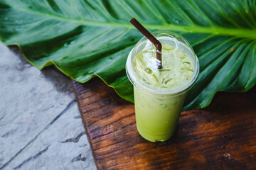 Iced green tea in takeaway cup