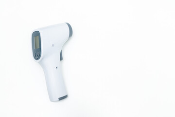 Temperature gun isolated on white background. Close up of laser thermometer with copy space for...