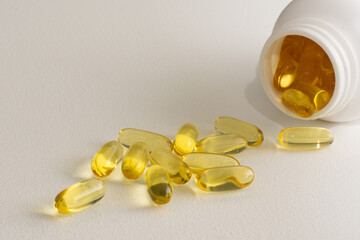 Vitamin D capsules tablets omega 3 healthy diet concept