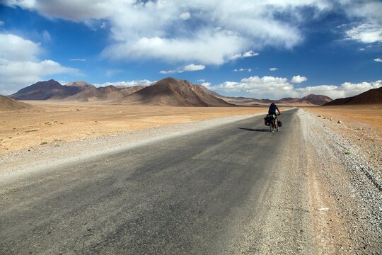 Pamir highway or pamirskij trakt with biker