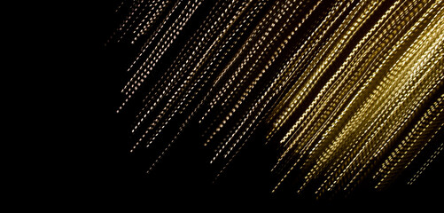 golden dashed lines of lights on black background