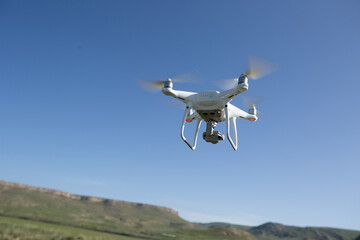 Flying drone taking photo of  landscape in China