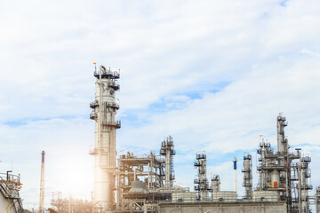 Industrial of oil refinery plant from industry zone ,Refinery factory oil storage tank and pipeline steel with blue sky.