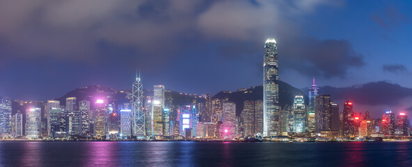 Panorama of Victoria harbor of Hong Kong city at night
