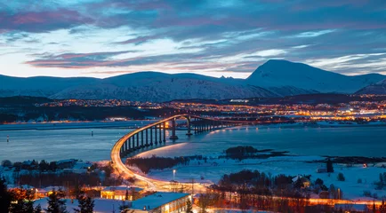 Tuinposter Beautiful winter or urban landscape of Tromso in Northern Norway at twilight blue hour - Arctic city of Tromso with bridge -Tromso, Norway © muratart