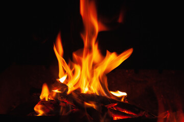 Beautiful pictures of fire flame against black background as symbol of hell and eternal pain.