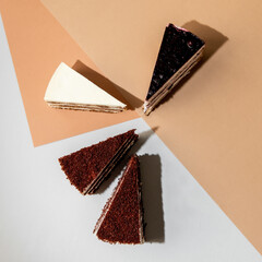 4 types of cakes. red velvet, milk girl, berry. 4 different pieces of cake. 