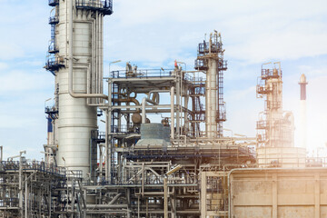 Industrial of oil refinery plant from industry zone ,Refinery factory oil storage tank and pipeline steel with blue sky.
