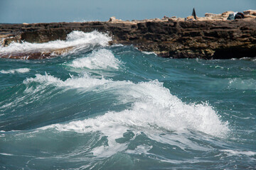 big waves hitting rocks in the sea of Italy 