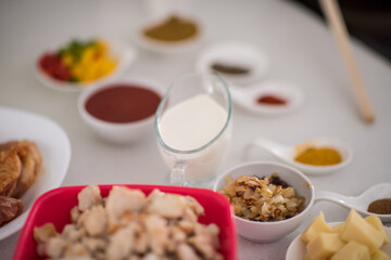 Preparing food in modern white kitchen
