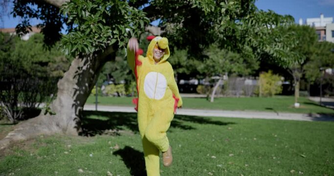 A girl dressed as a chicken. Funny video of a woman in a chicken costume. Chicken with egg. The girl and the chicken egg.