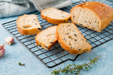 Homemade Italian ciabatta bread with herbs, garlic and olives