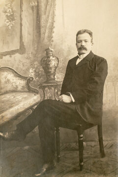 Germany - CIRCA 1910-20s: Rich man sitting in studio. Vintage cabinet card Edwardian era male portrait photo