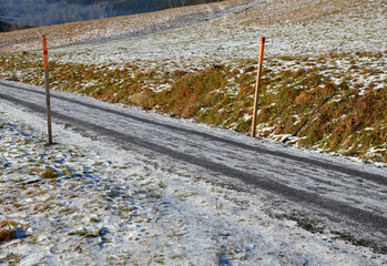 marking the way for winter maintenance using wooden posts, beams, bars. a sunken and closed road...
