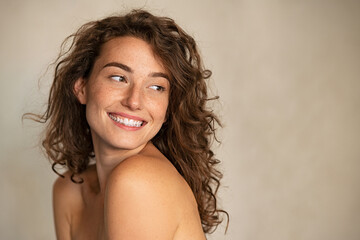 Smiling beauty woman with freckles looking away - obrazy, fototapety, plakaty