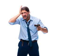 Despaired young male employee holding handgun