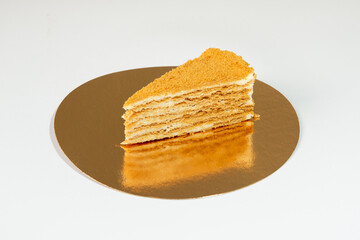 slice of orange cake on  golden plate