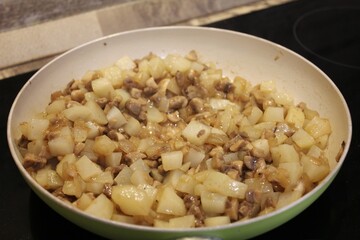 
Fried potatoes with mushrooms and onions.