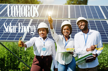 Comoros solar energy. African engineers at panels station.