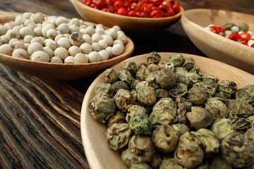 Pile of peppercorn on wooden table macro